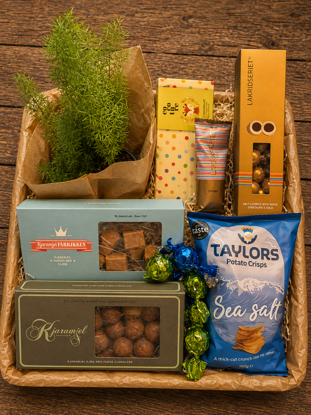 Gavekurv fyldt med chips, cocoture, lakridsbar, fyldte chokolader. 